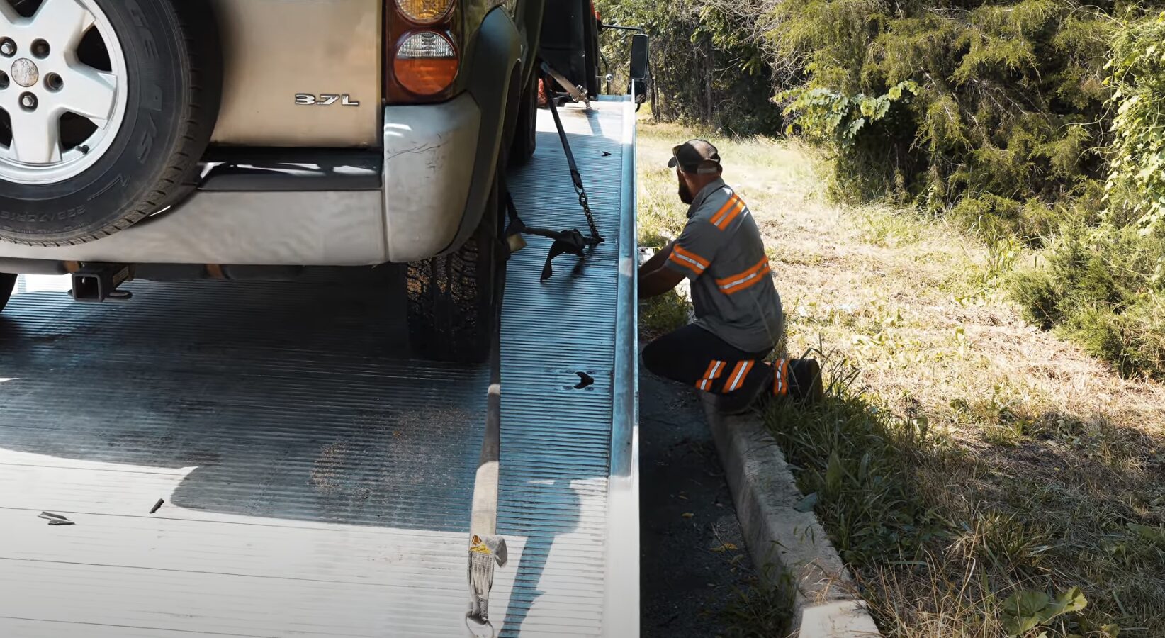 Professional roadside assistance and vehicle recovery Roadside assistance technician helping with vehicle recovery